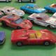 Back row: Impy Jaguar MK X, Matchbox Ford GT, Ford Cortina, Rolls Royce Silver Shadow Coupe. Middel row: Mercedes 230 SL, HW Sizzlers Ford Mark IV, Lesney Mustang, MBX Superfast Datsun 260Z. Front row: Lesney Iso Grifo, Porsche 910, Lamborghini Miura